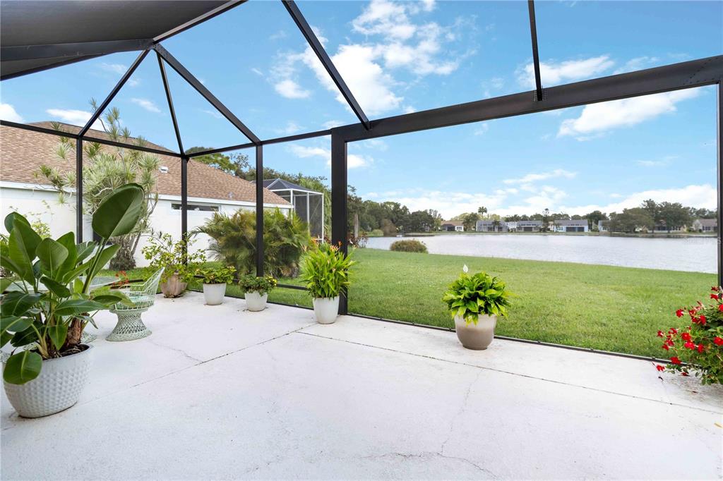 357 Fareham Drive Venice, FL 34293 - Photo 25 of 34 a view of a lake with a garden