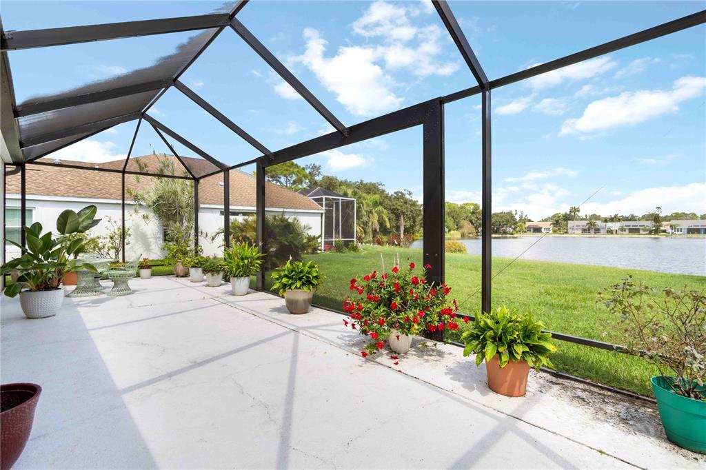 357 Fareham Drive Venice, FL 34293 - Photo 27 of 34 a view of a balcony with chair and potted plants