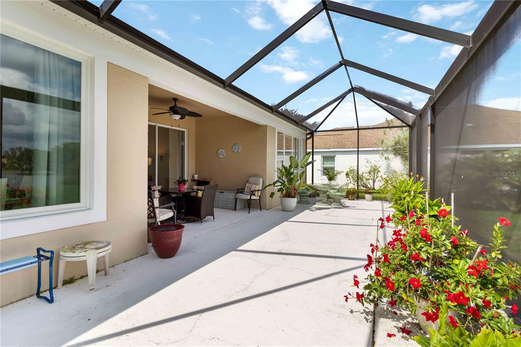 357 Fareham Drive Venice, FL 34293 - Photo 28 of 34 a view of a patio with table and chairs potted plants