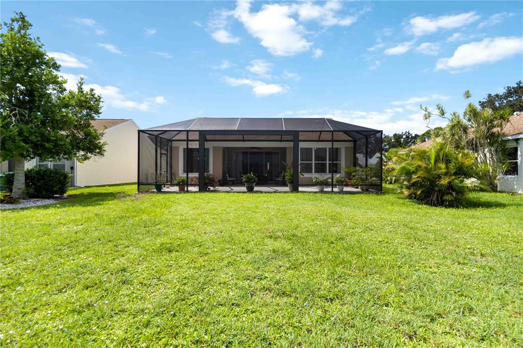 357 Fareham Drive Venice, FL 34293 - Photo 32 of 34 a front view of house with yard and green space