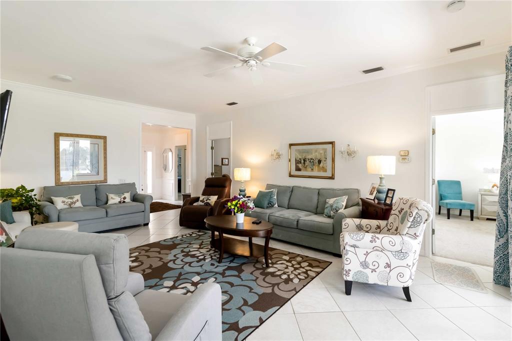 357 Fareham Drive Venice, FL 34293 - Photo 5 of 34 a living room with furniture or couches and a coffee table