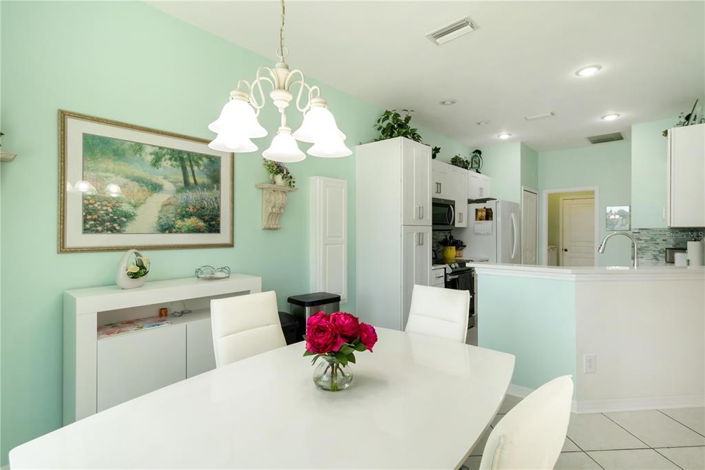 357 Fareham Drive Venice, FL 34293 - Photo 6 of 34 a very nice looking dining room with kitchen island a chandelier