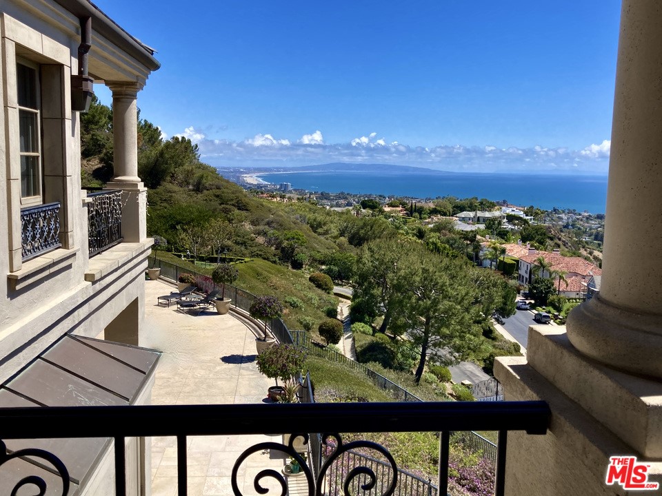 16375 Shadow Mountain Drive Pacific Palisades, CA 90272 - Photo 32 of 50 view of a balcony with an outdoor space and seating