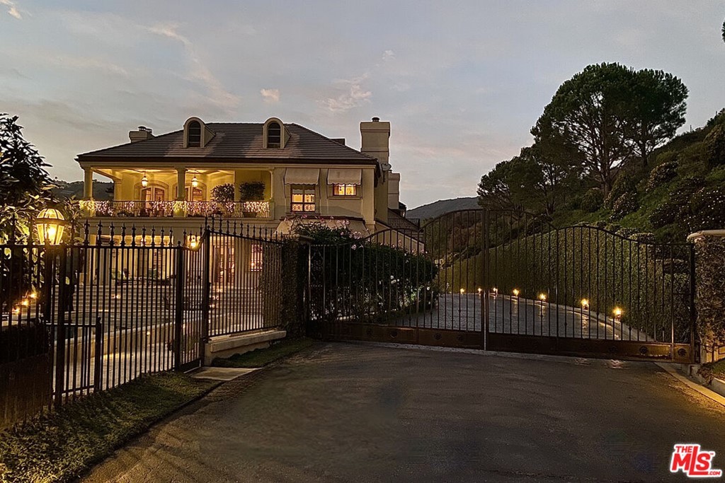 16375 Shadow Mountain Drive Pacific Palisades, CA 90272 - Photo 43 of 50 a front view of a house with street