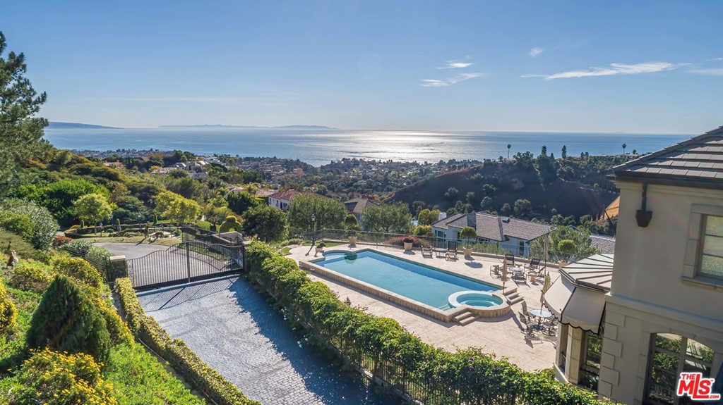 16375 Shadow Mountain Drive Pacific Palisades, CA 90272 - Photo 5 of 50 an aerial view of a house with a garden and lake view