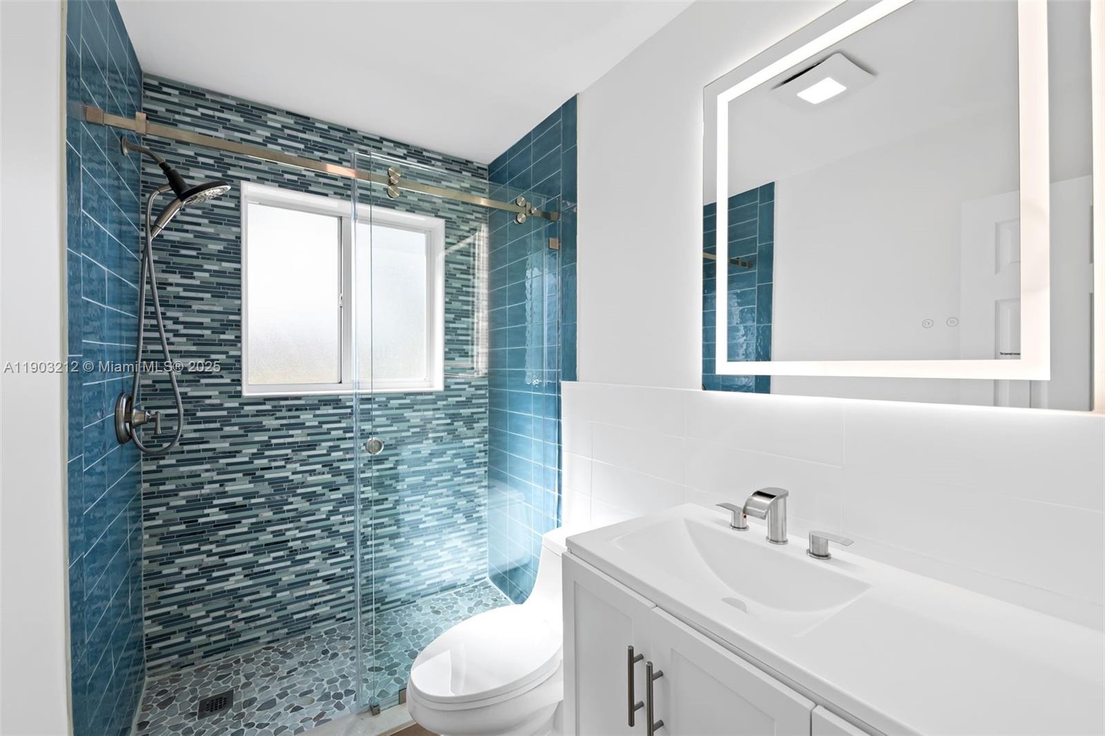 3207 Wilson Street Hollywood, FL 33021 - Photo 12 of 18 a bathroom with a sink a toilet and shower