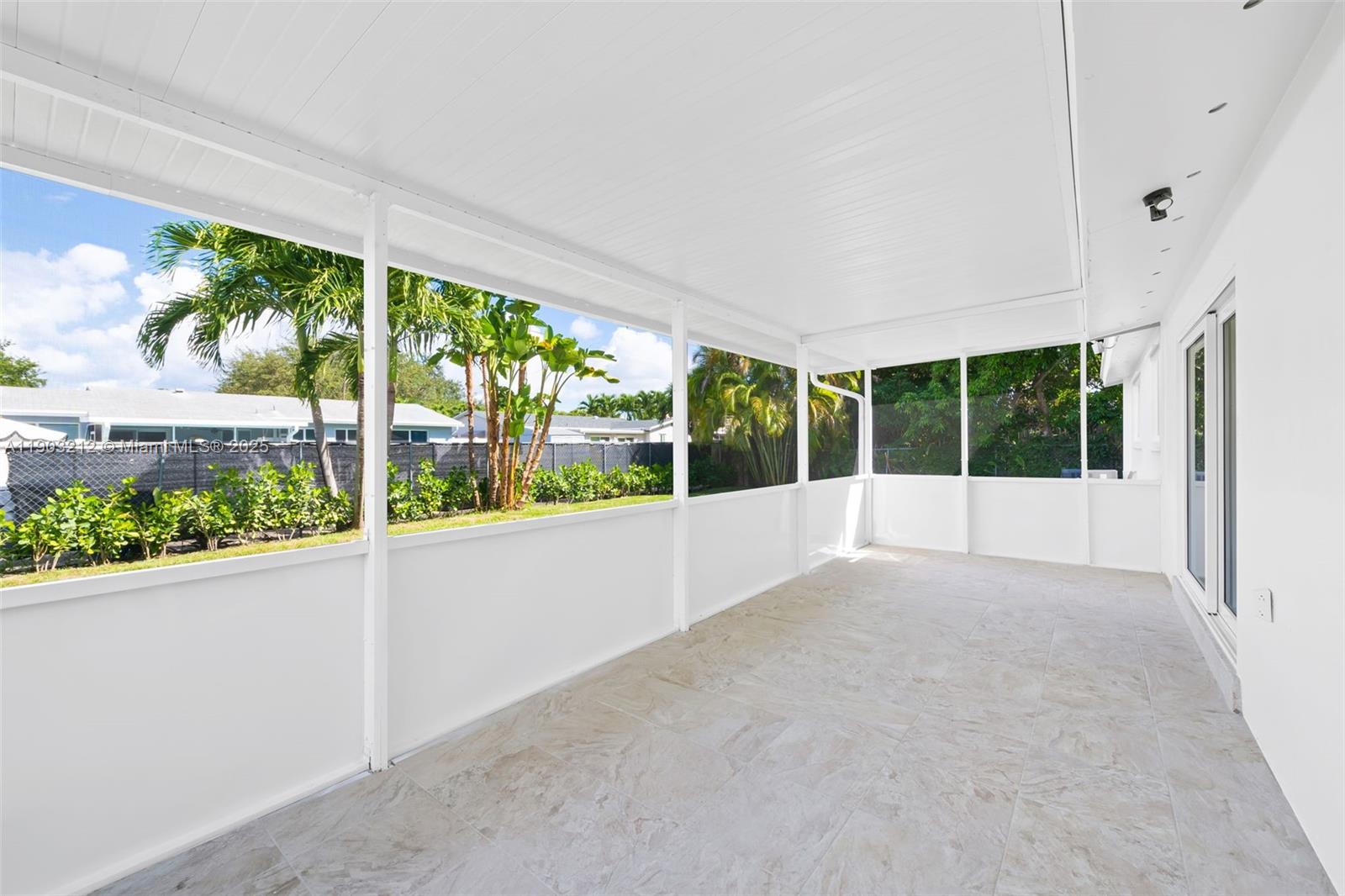 3207 Wilson Street Hollywood, FL 33021 - Photo 14 of 18 a view of an empty room with a large window