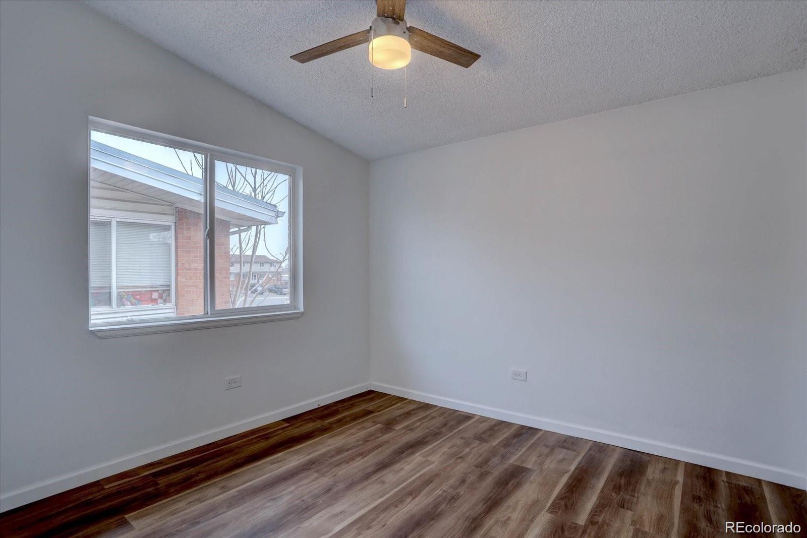 2938 Eliot Circle, Unit 2 Westminster, CO 80030 - Photo 10 of 28 a view of empty room with window
