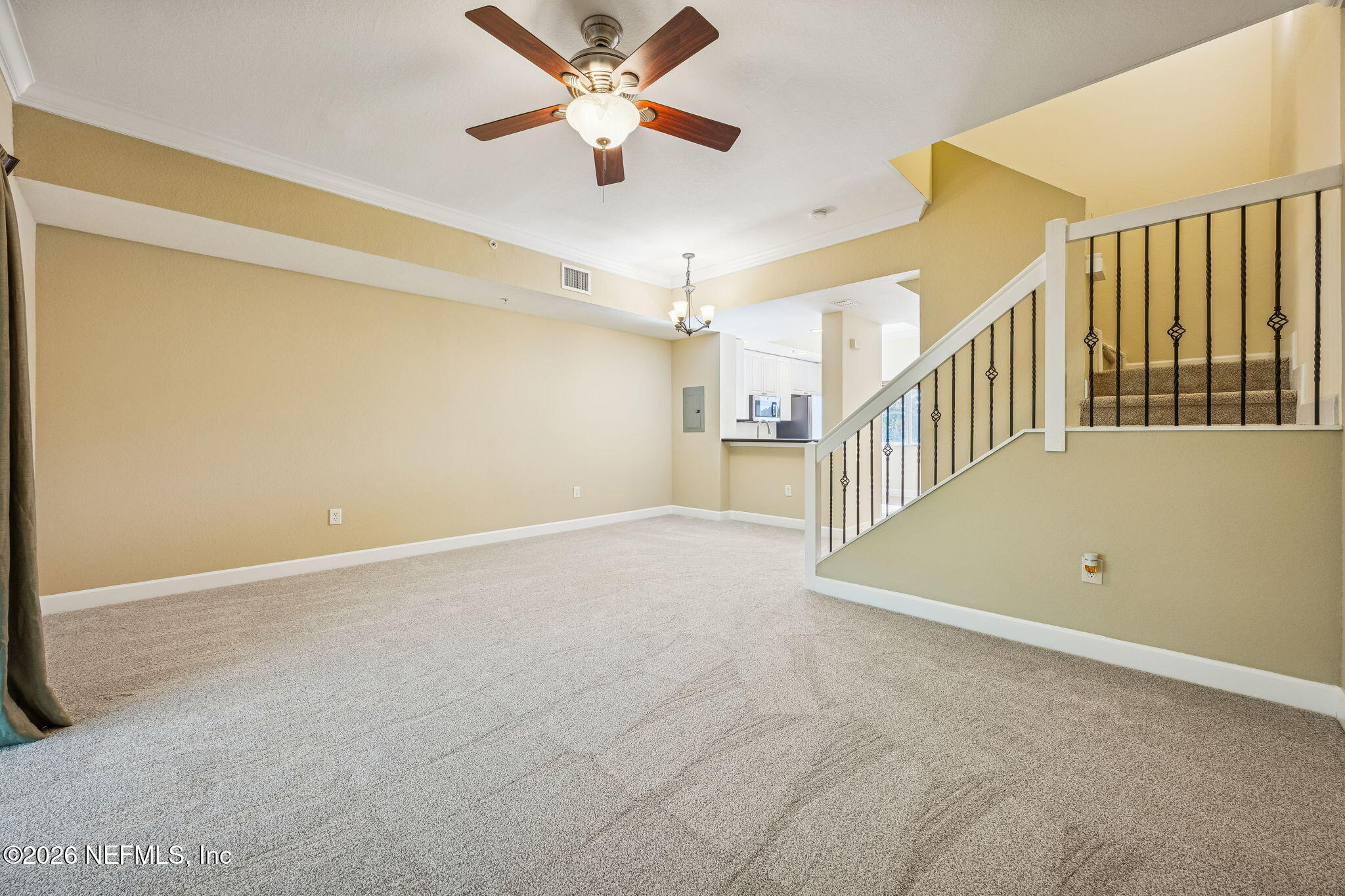 9745 Touchton Road, Unit 2125 Jacksonville, FL 32246 - Photo 19 of 50 an empty room with ceiling fan and windows