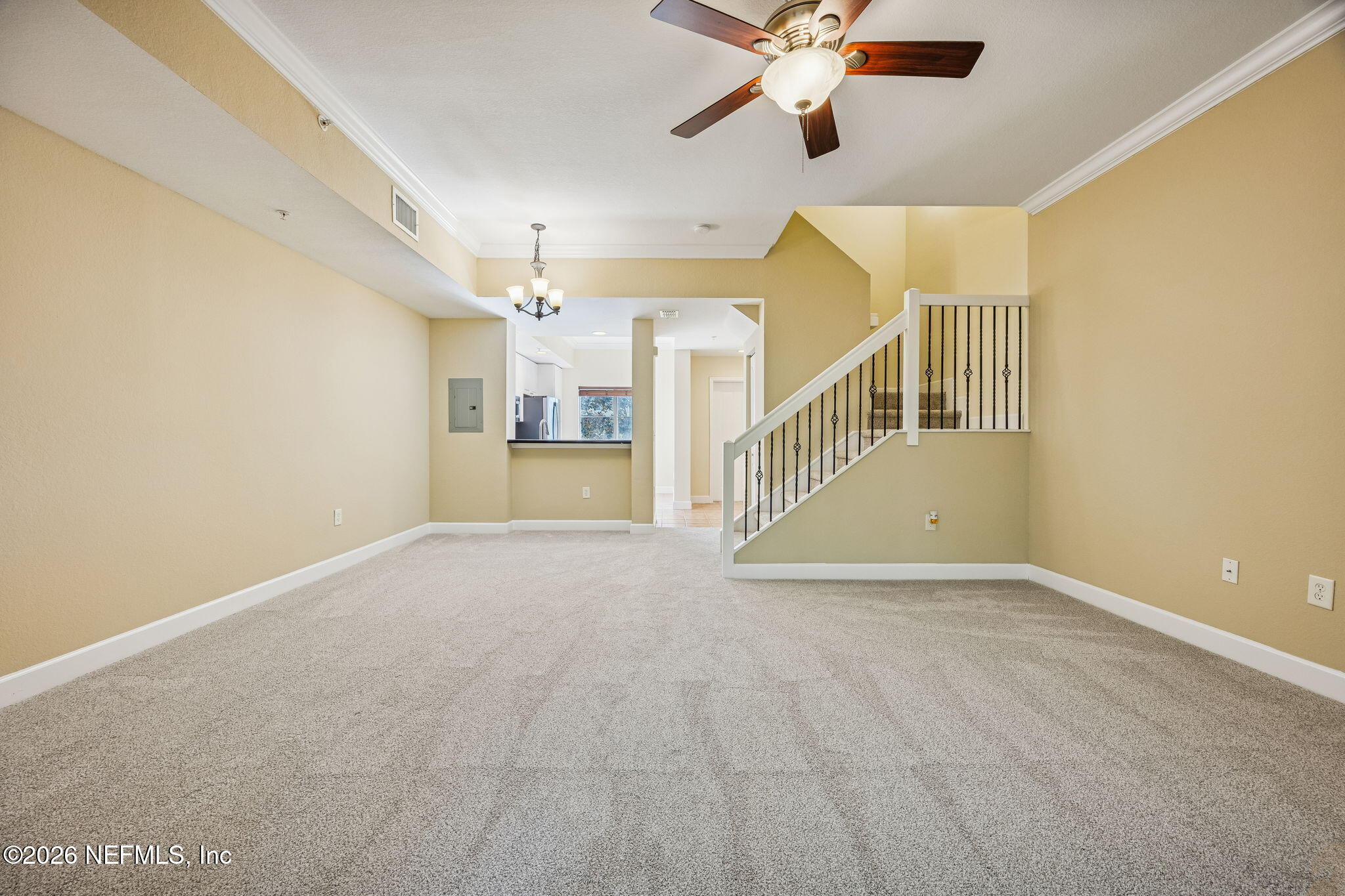 9745 Touchton Road, Unit 2125 Jacksonville, FL 32246 - Photo 21 of 50 a view of a room with a ceiling fan and window