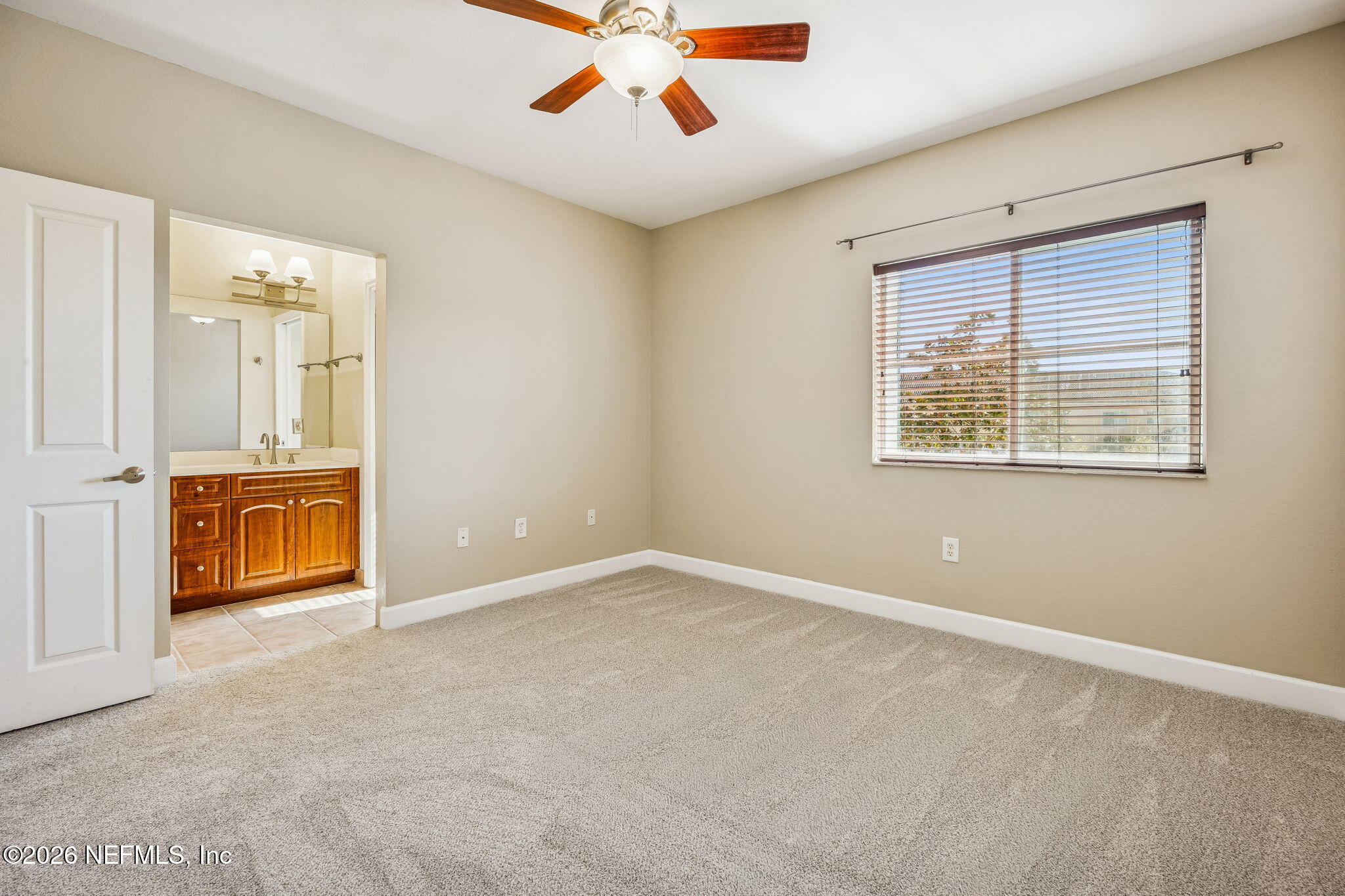 9745 Touchton Road, Unit 2125 Jacksonville, FL 32246 - Photo 23 of 50 an empty room with a ceiling fan and a window