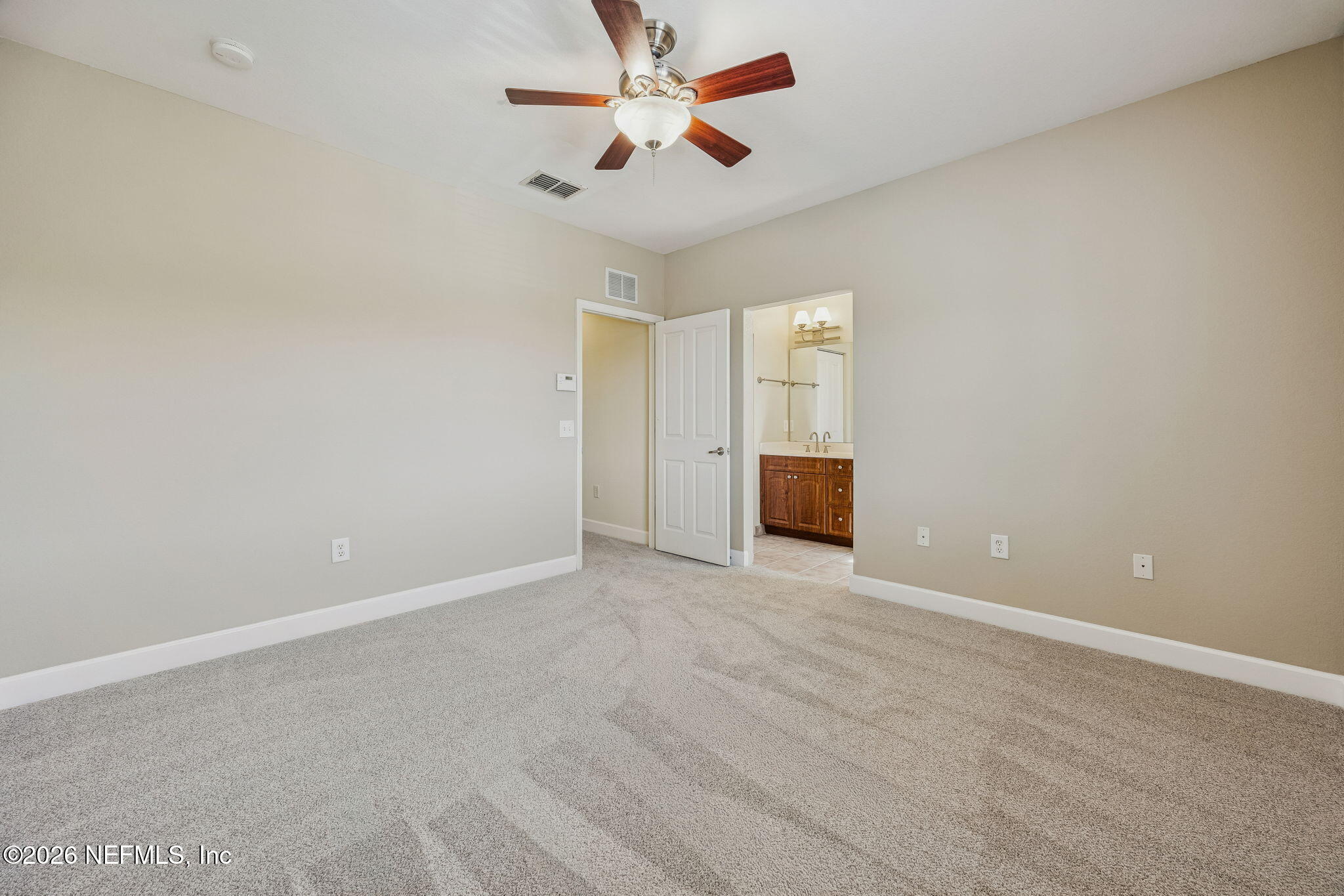 9745 Touchton Road, Unit 2125 Jacksonville, FL 32246 - Photo 24 of 50 an empty room with a empty space and a ceiling fan