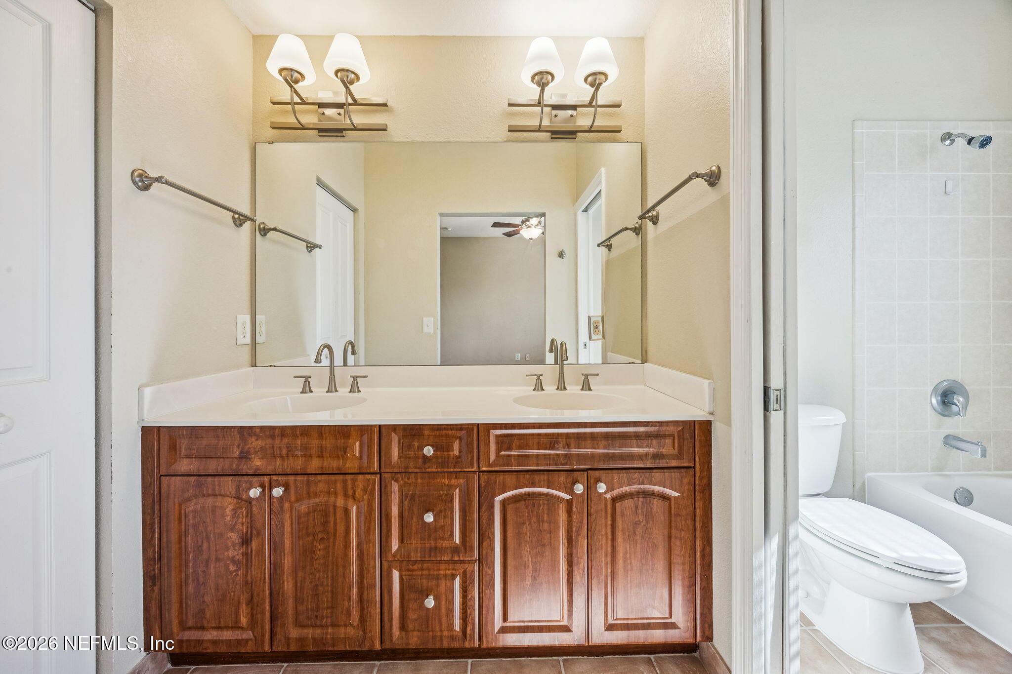 9745 Touchton Road, Unit 2125 Jacksonville, FL 32246 - Photo 26 of 50 a bathroom with a sink and a toilet