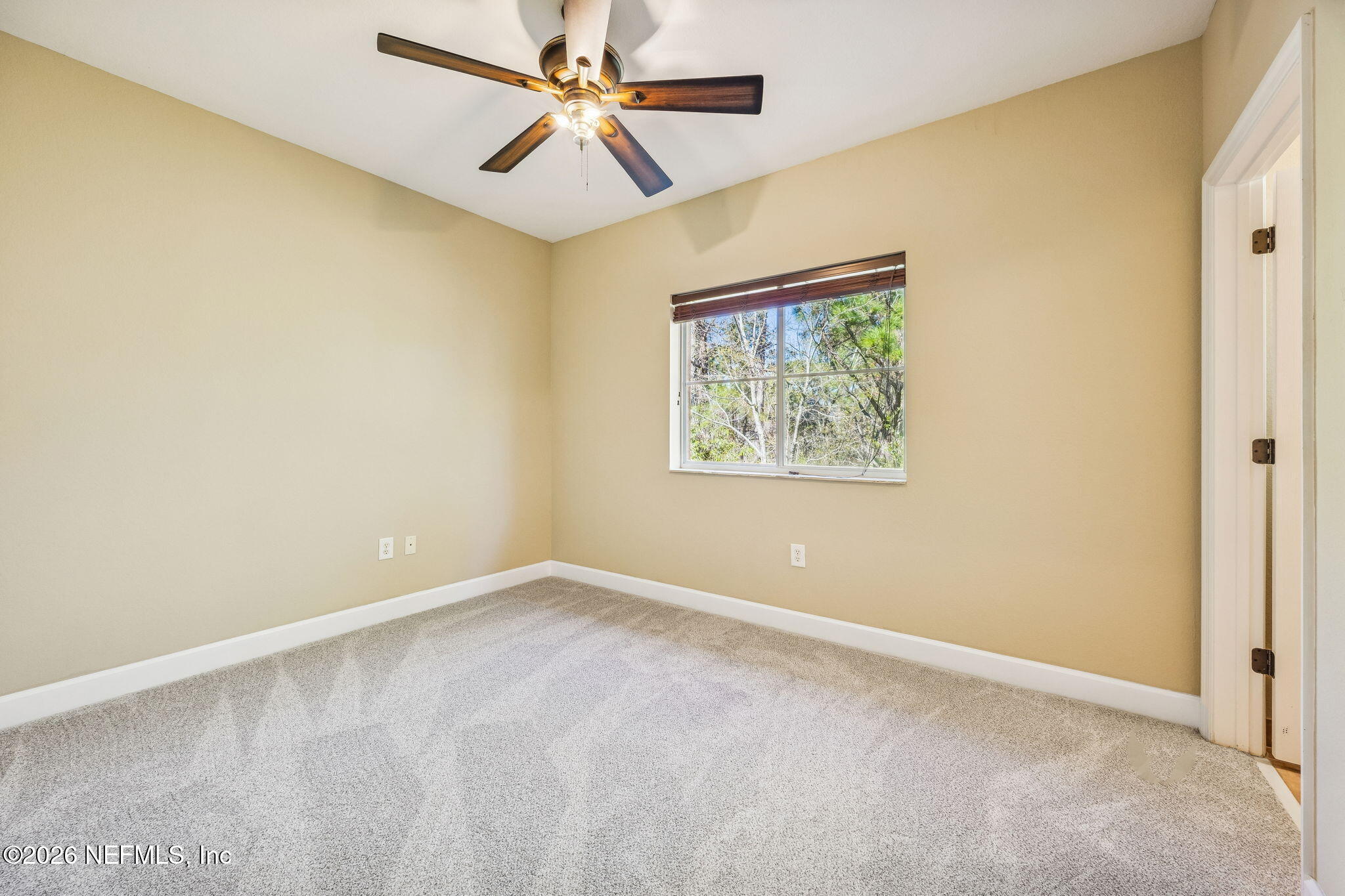 9745 Touchton Road, Unit 2125 Jacksonville, FL 32246 - Photo 28 of 50 an empty room with a window and a fan