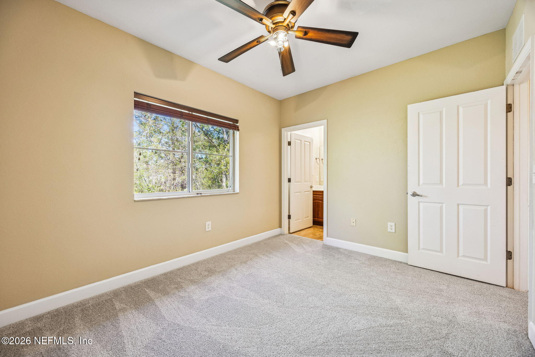 9745 Touchton Road, Unit 2125 Jacksonville, FL 32246 - Photo 30 of 50 an empty room with windows and fan