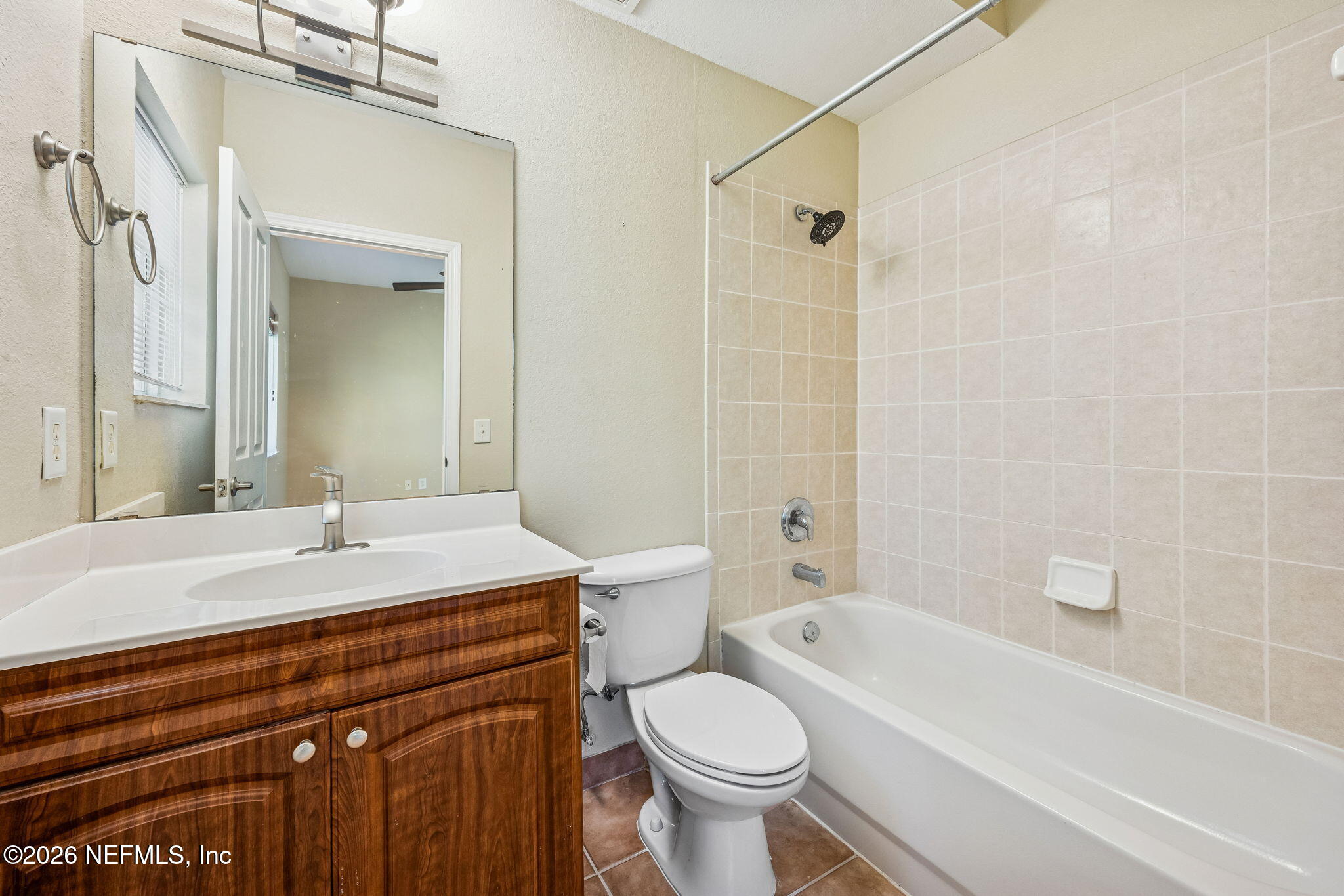 9745 Touchton Road, Unit 2125 Jacksonville, FL 32246 - Photo 31 of 50 a bathroom with a sink a toilet and a bathtub