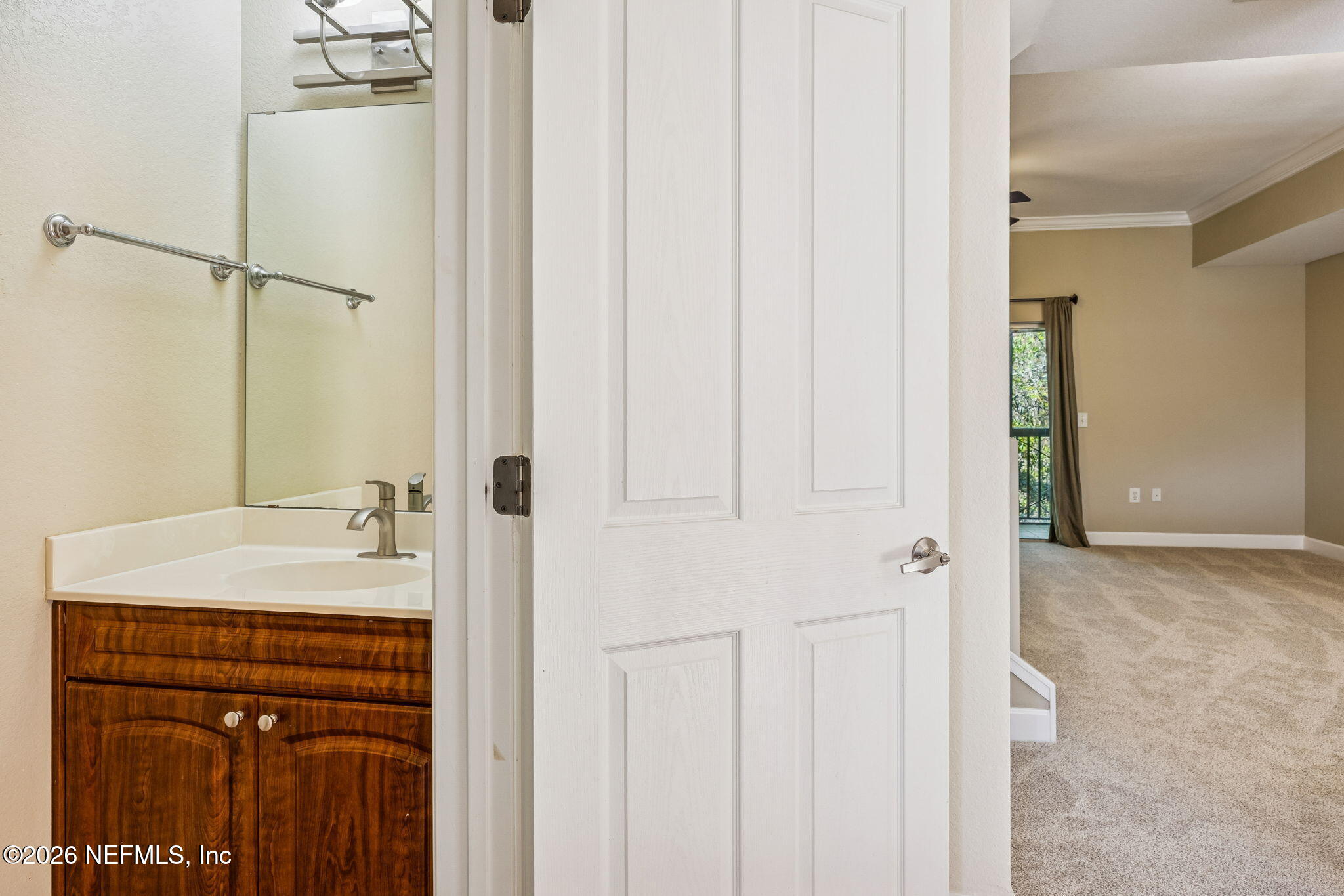 9745 Touchton Road, Unit 2125 Jacksonville, FL 32246 - Photo 33 of 50 a bathroom with a sink and a mirror