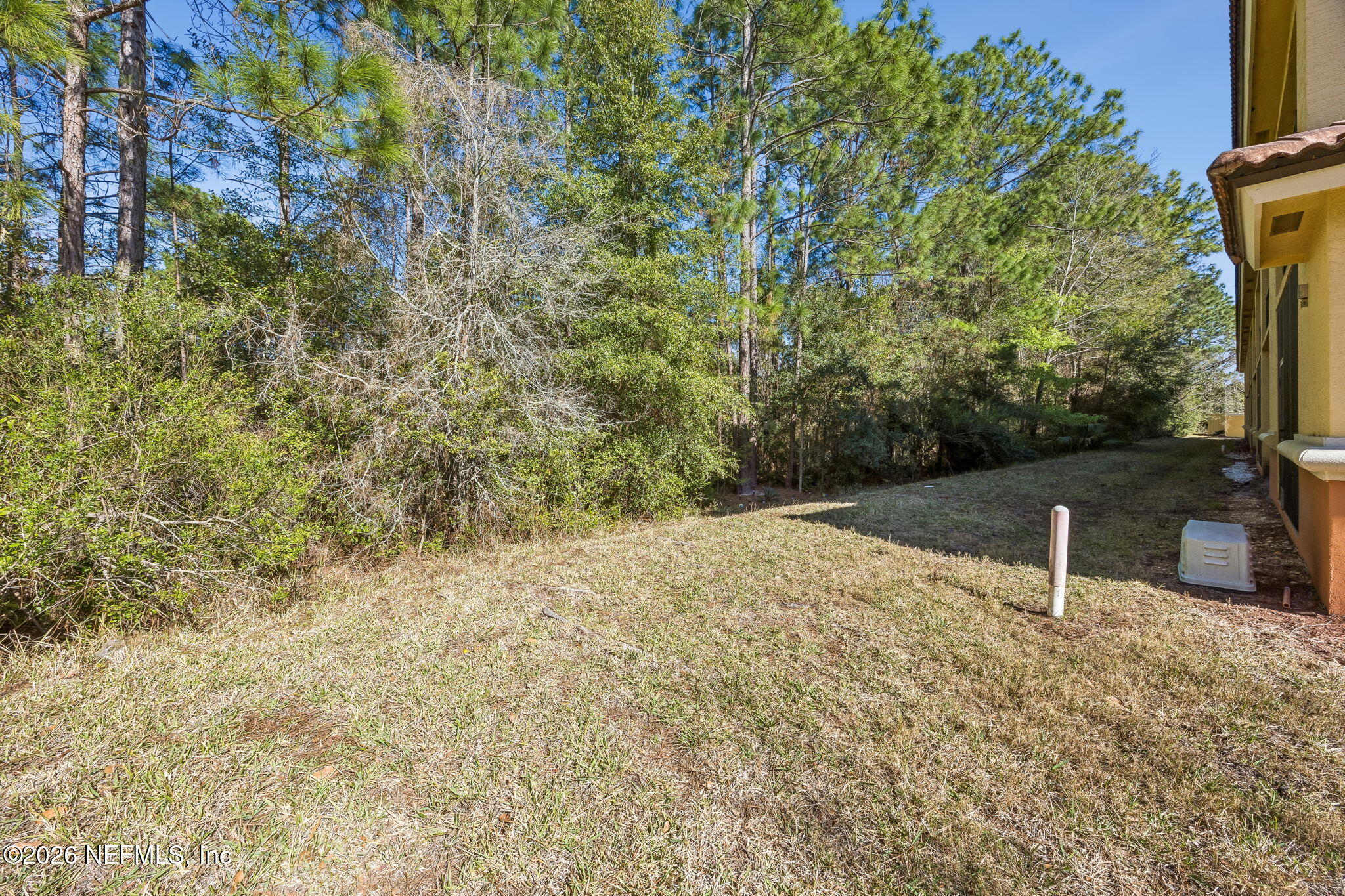 9745 Touchton Road, Unit 2125 Jacksonville, FL 32246 - Photo 37 of 50 a backyard of a house with yard and outdoor seating