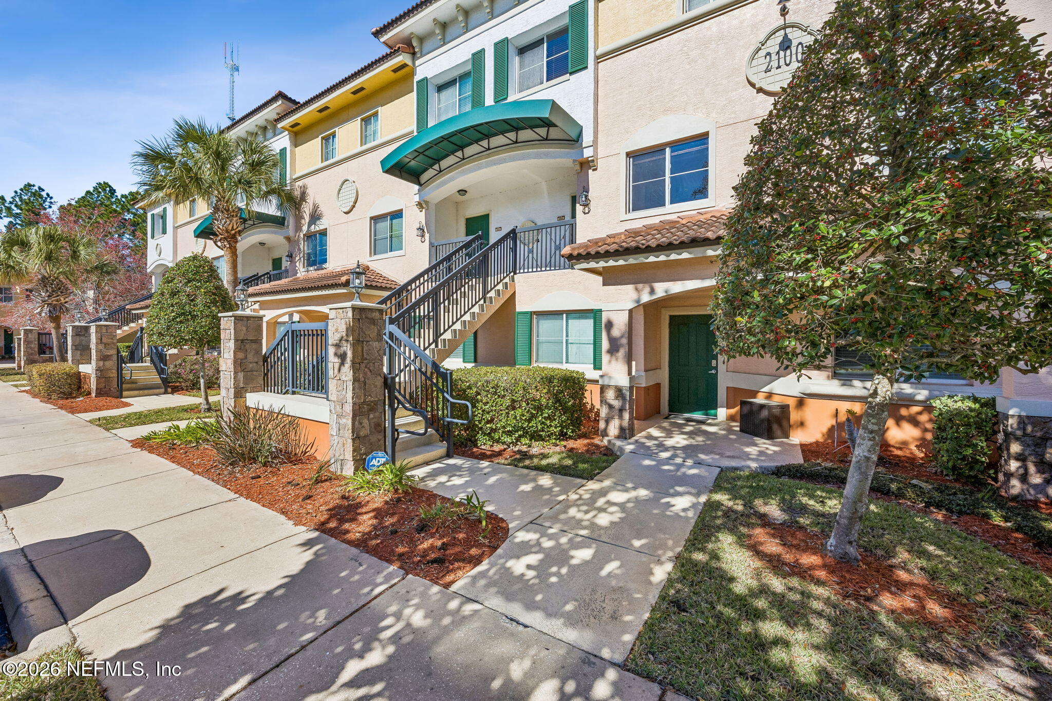 9745 Touchton Road, Unit 2125 Jacksonville, FL 32246 - Photo 4 of 50 a front view of a house with a yard