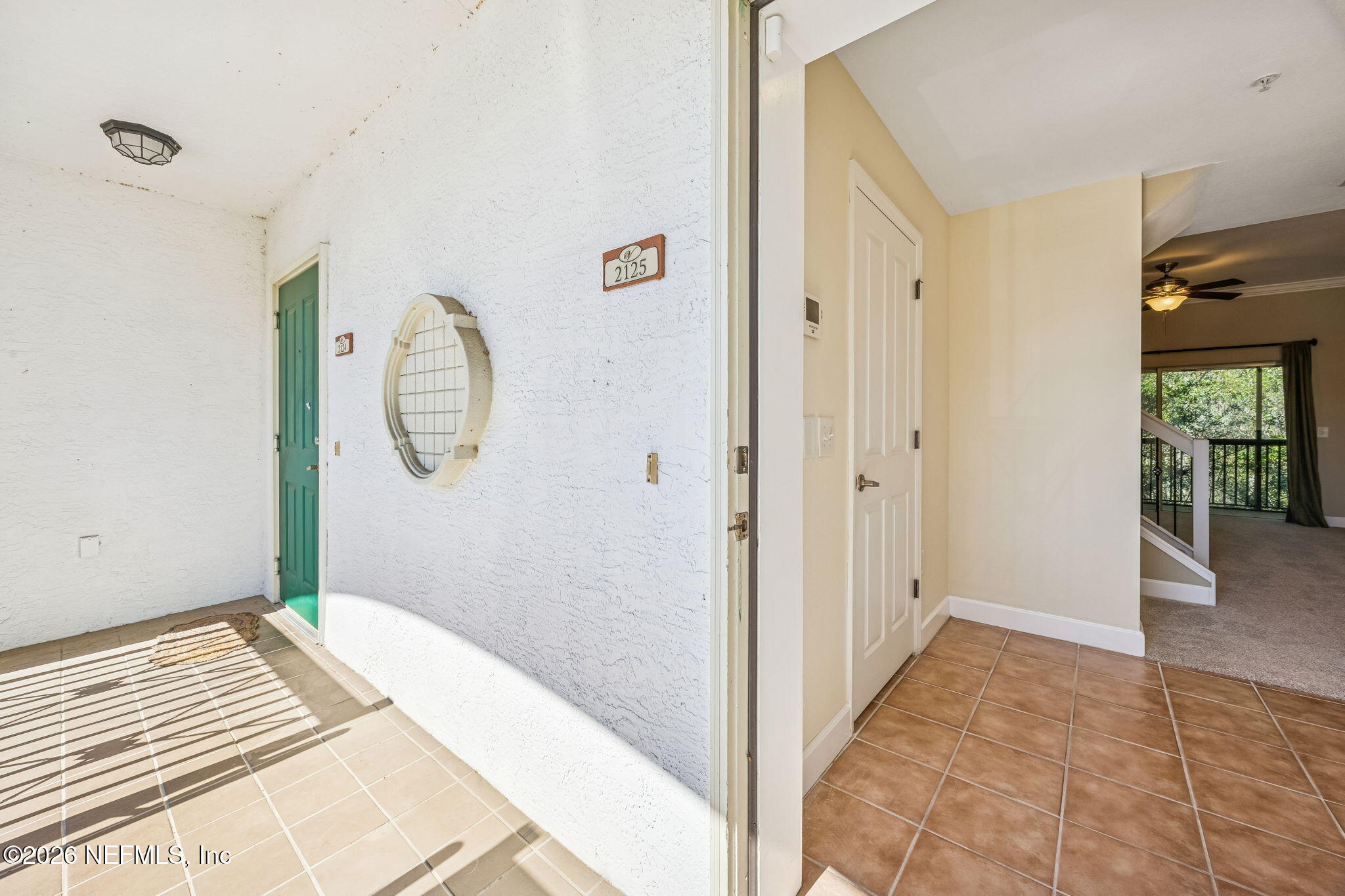 9745 Touchton Road, Unit 2125 Jacksonville, FL 32246 - Photo 6 of 50 a view of a room with wooden floor and a bathroom