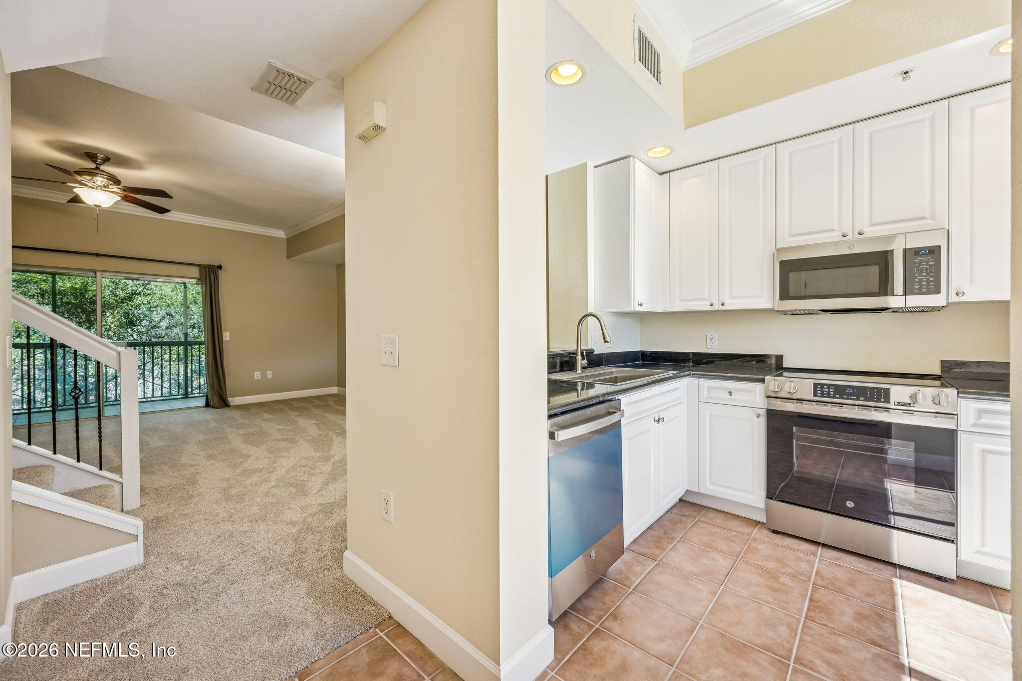 9745 Touchton Road, Unit 2125 Jacksonville, FL 32246 - Photo 7 of 50 a view of a kitchen with electric appliances