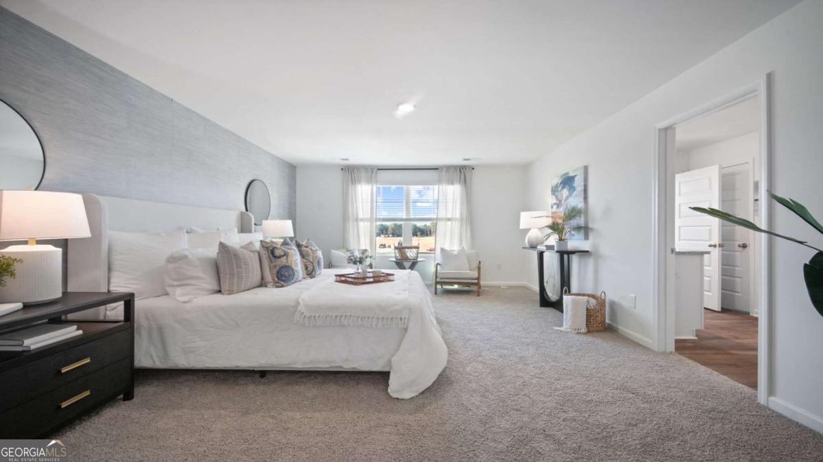 149 Timber Road Statesboro, GA 30458 - Photo 19 of 42 a bedroom with bed and a night stand