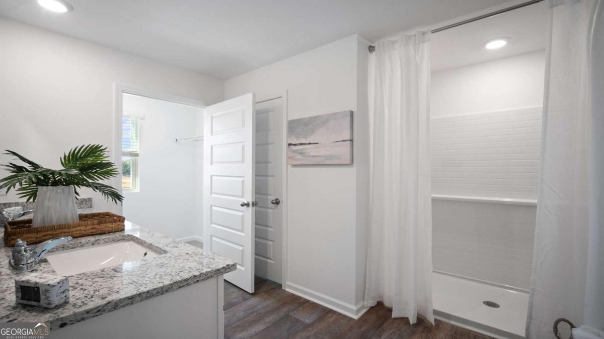 149 Timber Road Statesboro, GA 30458 - Photo 22 of 42 a bathroom with a granite countertop sink and a mirror