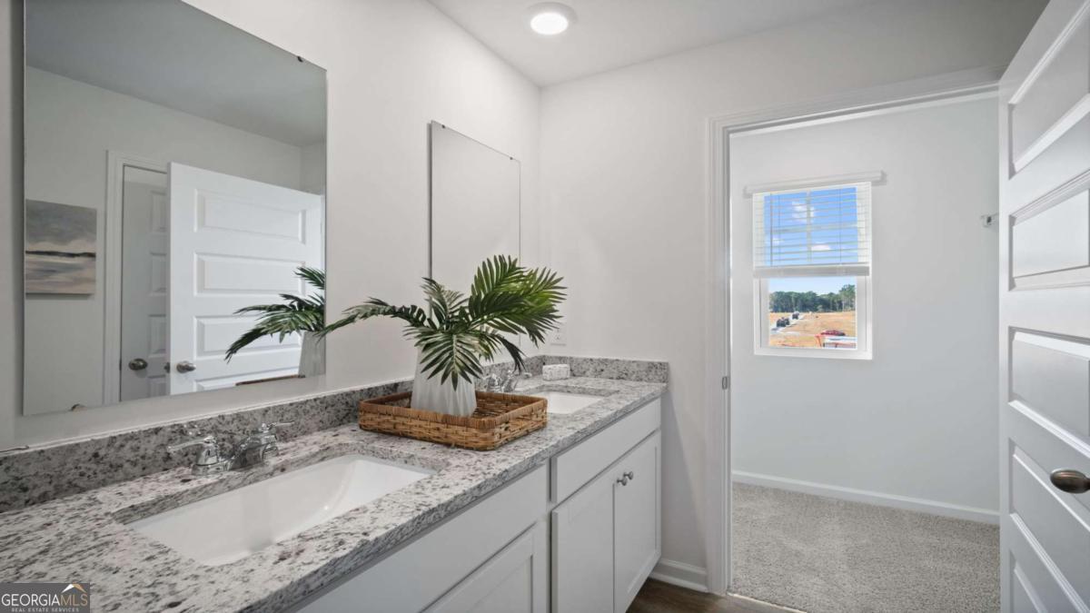149 Timber Road Statesboro, GA 30458 - Photo 23 of 42 a room with a potted plant on the counter and a sink