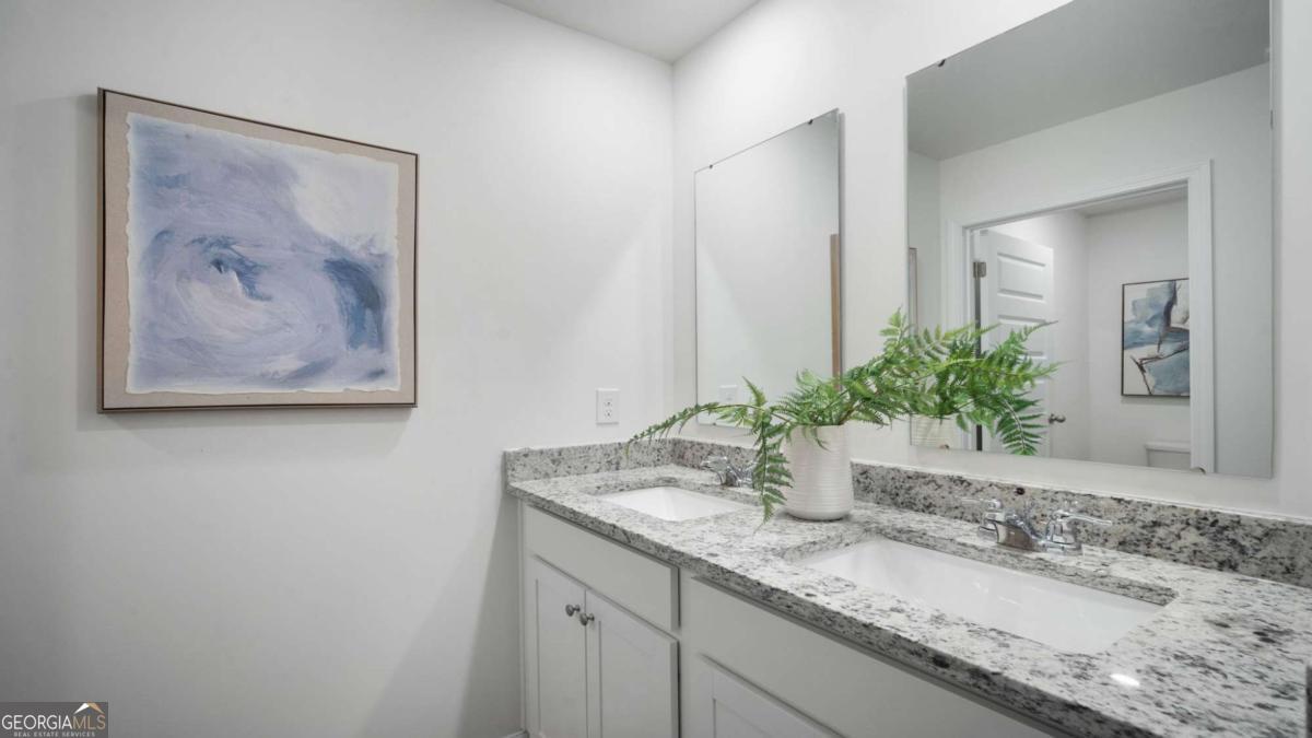 149 Timber Road Statesboro, GA 30458 - Photo 34 of 42 a bathroom with a granite countertop sink and a mirror