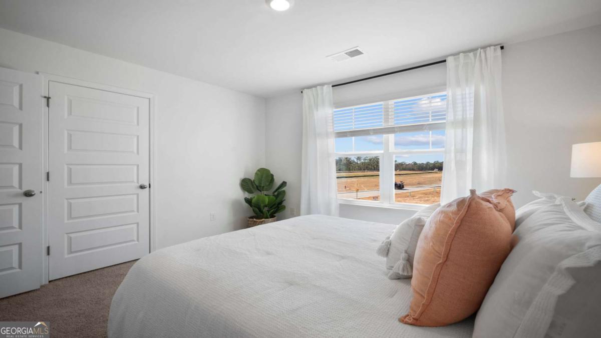 149 Timber Road Statesboro, GA 30458 - Photo 37 of 42 a bedroom with a bed and a window