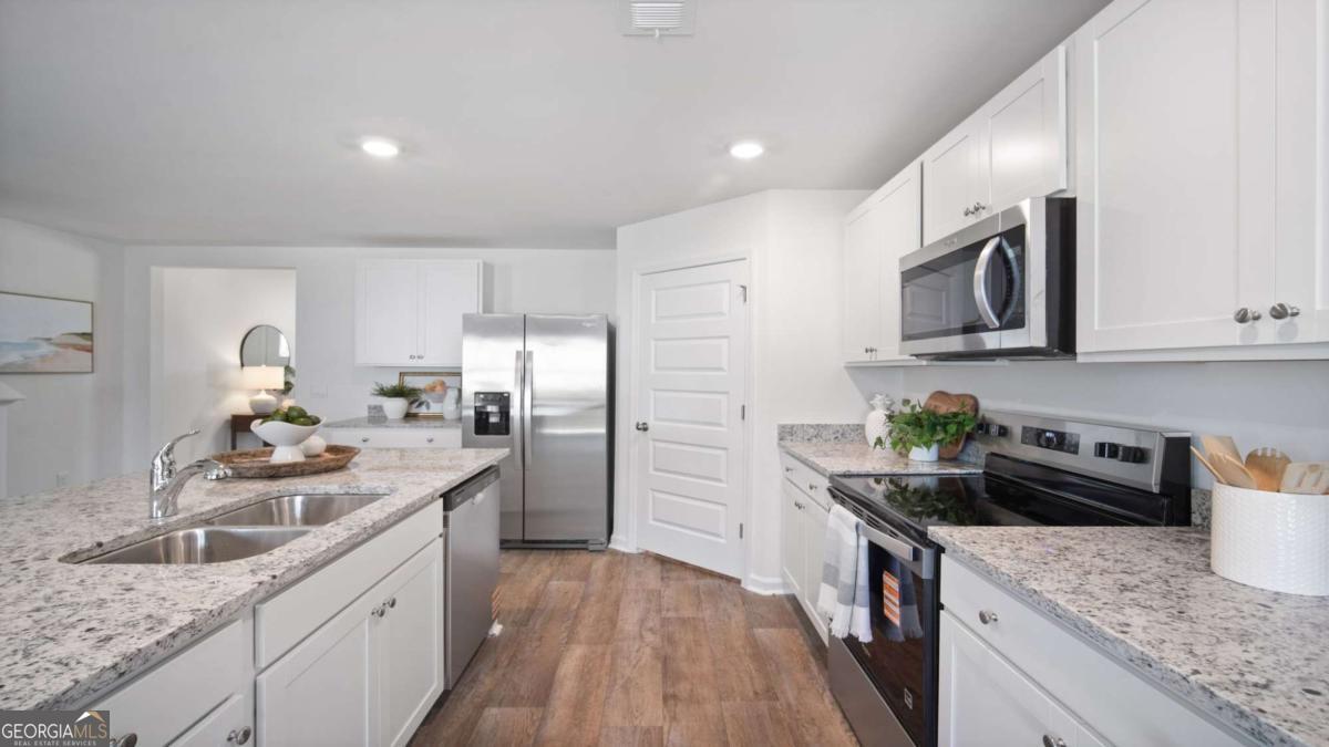 149 Timber Road Statesboro, GA 30458 - Photo 7 of 42 a kitchen with a sink stove top oven and refrigerator