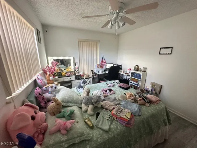 a bed room with bed and a window