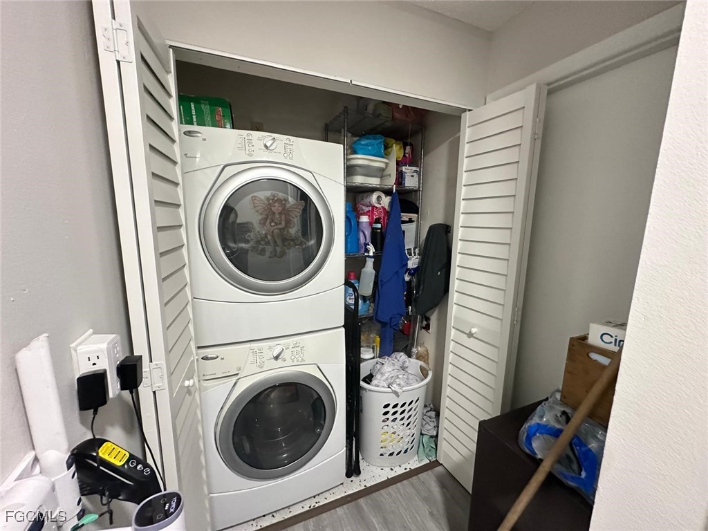 19 Pinewood Boulevard Lehigh Acres, FL 33936 - Photo 21 of 25 a utility room with dryer and washer