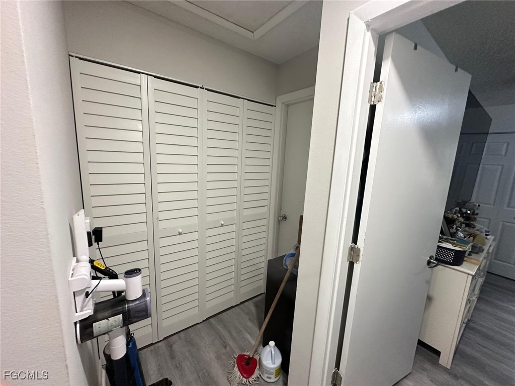 19 Pinewood Boulevard Lehigh Acres, FL 33936 - Photo 22 of 25 a view of a hallway with workspace