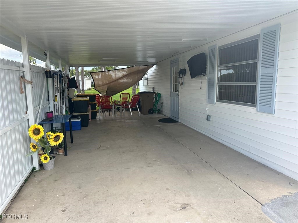 19 Pinewood Boulevard Lehigh Acres, FL 33936 - Photo 23 of 25 a view of a garage with furniture