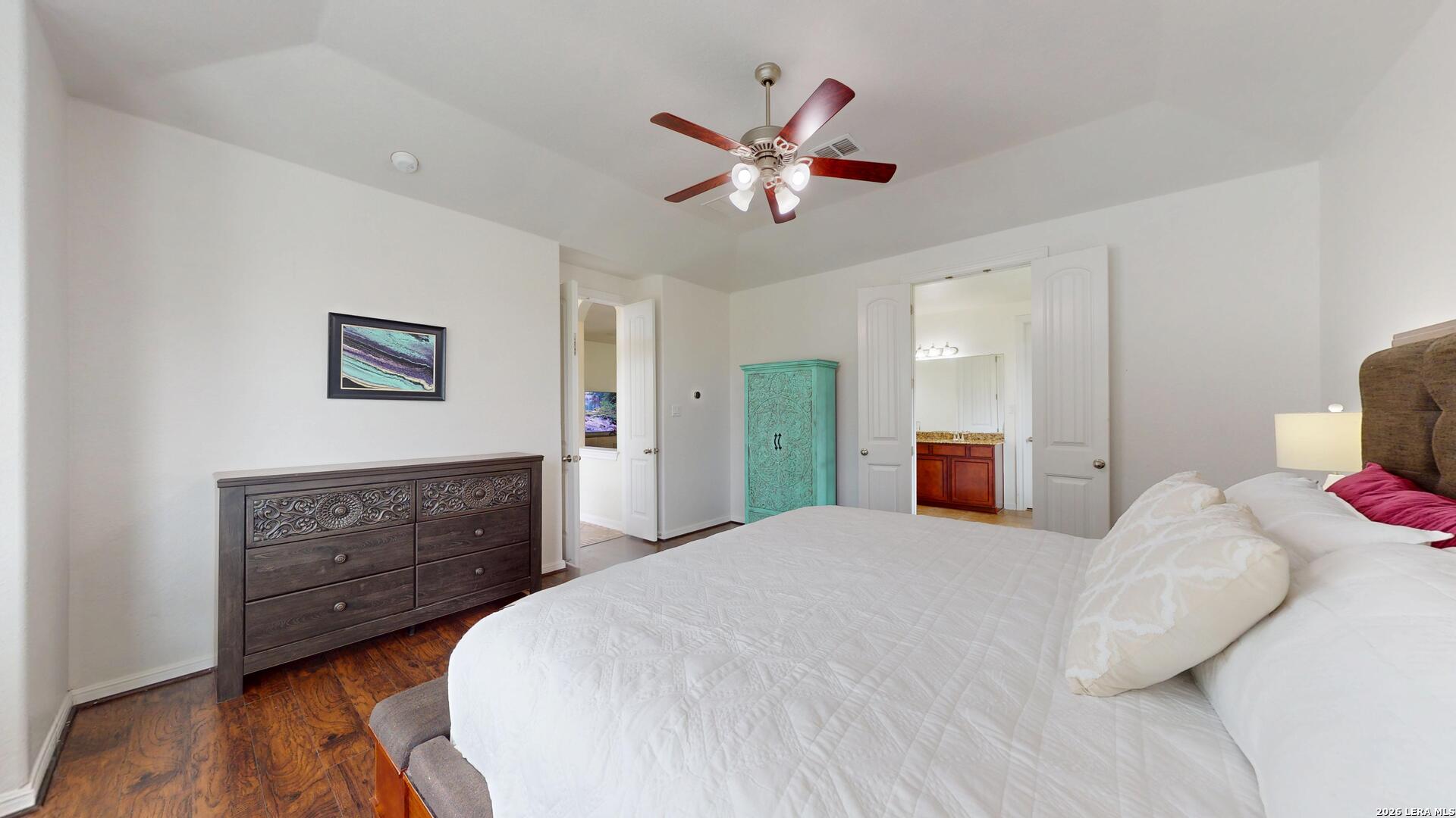 10111 Shallow Bank Converse, TX 78109 - Photo 43 of 65 a bedroom with a bed and a dresser