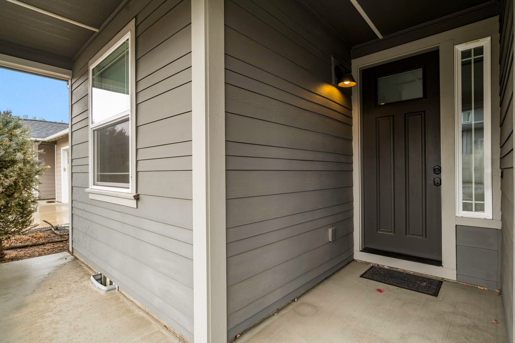 A small, patio welcomes you into the home...