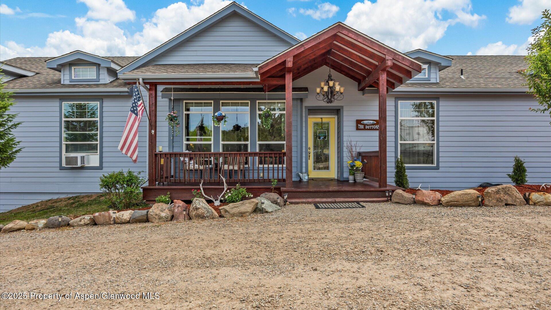 40380 D Road Crawford, CO 81415 - Photo 11 of 52 a front view of a house with sitting area and furniture