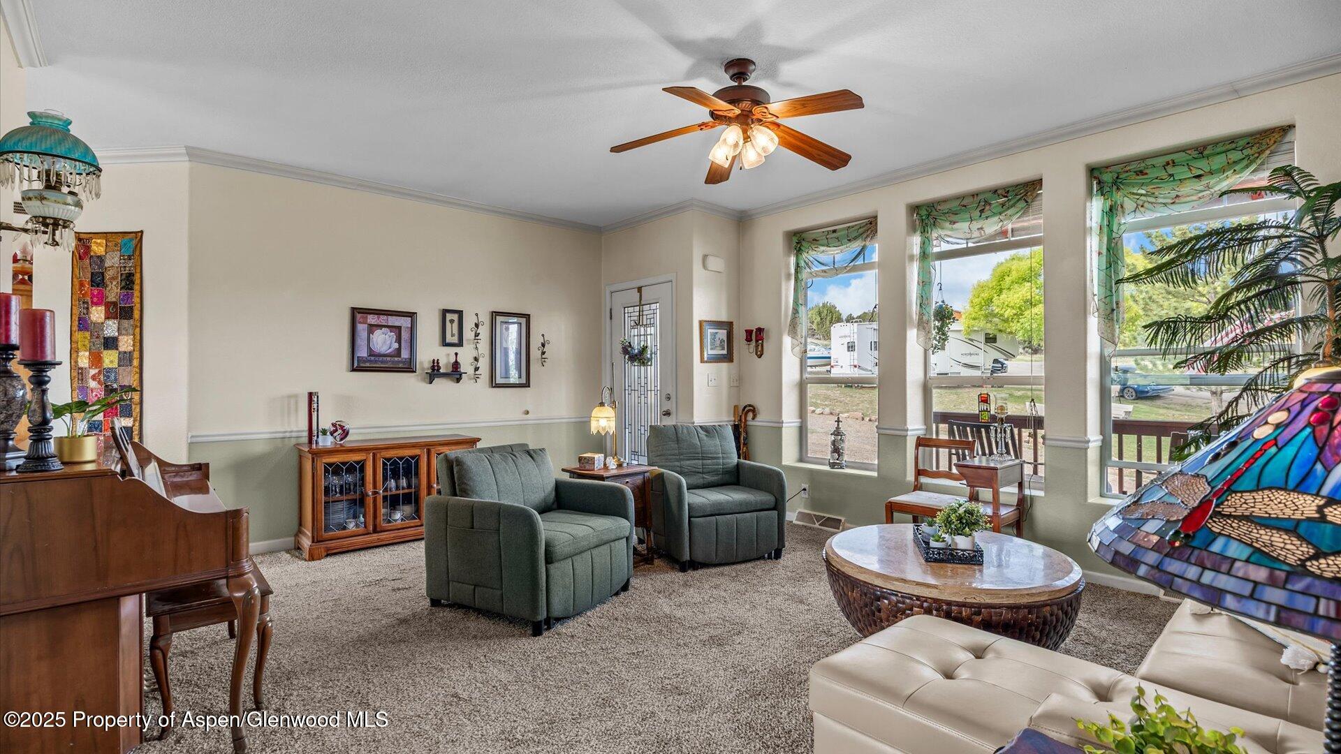 40380 D Road Crawford, CO 81415 - Photo 13 of 52 a living room with furniture a flat screen tv and a large window