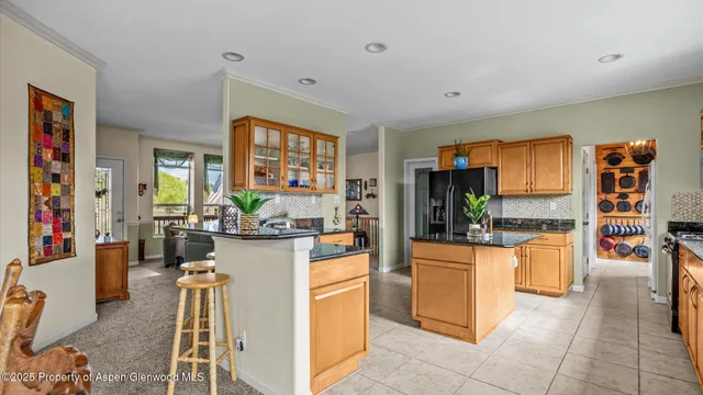 a kitchen with a refrigerator and a stove