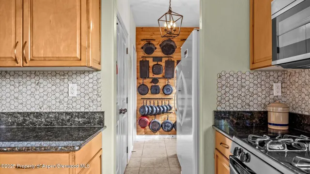 a kitchen with a stove and a microwave