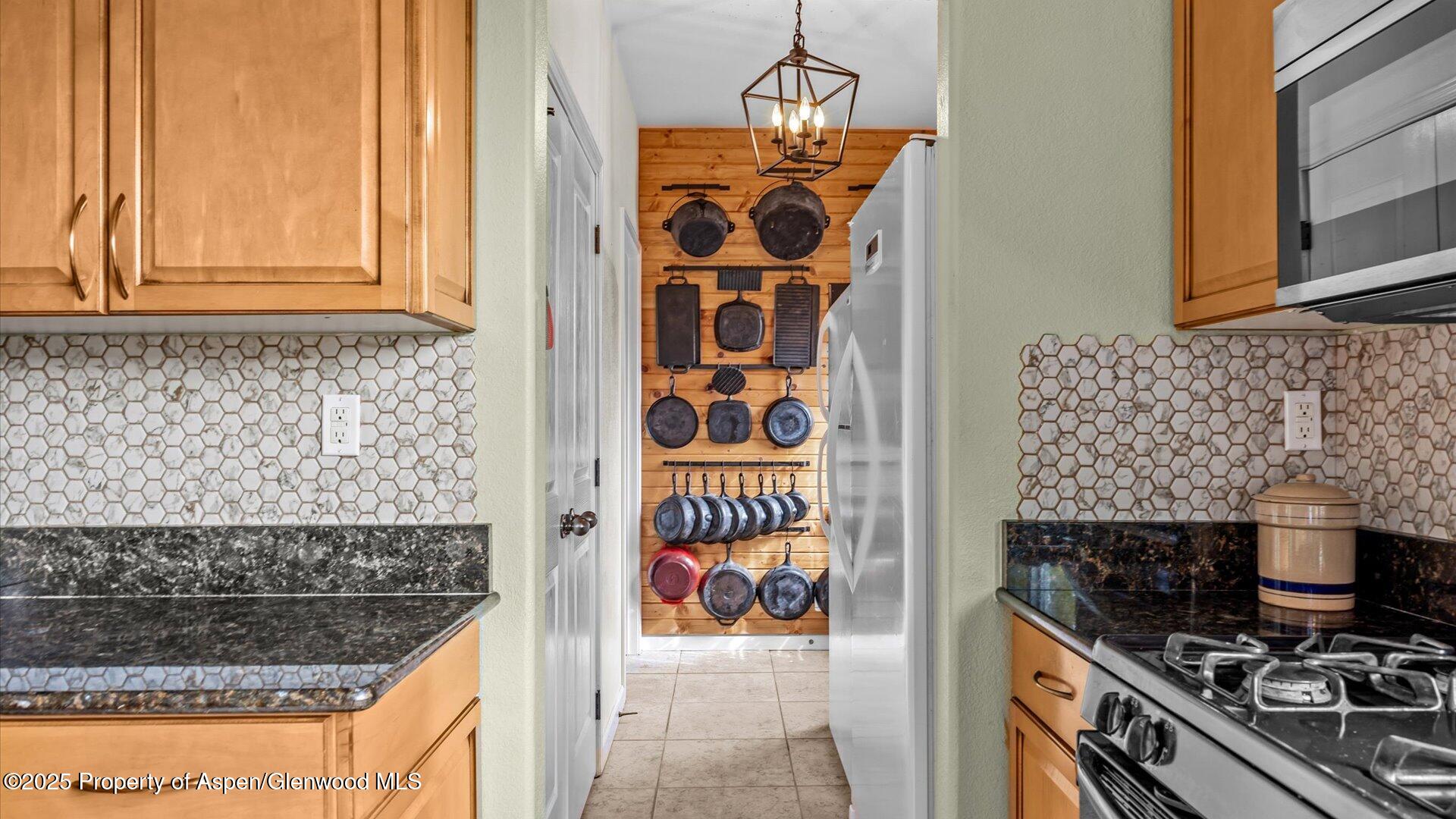 40380 D Road Crawford, CO 81415 - Photo 17 of 52 a kitchen with a stove and a microwave