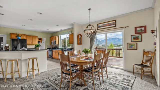 a view of a dining room with furniture window and outside view