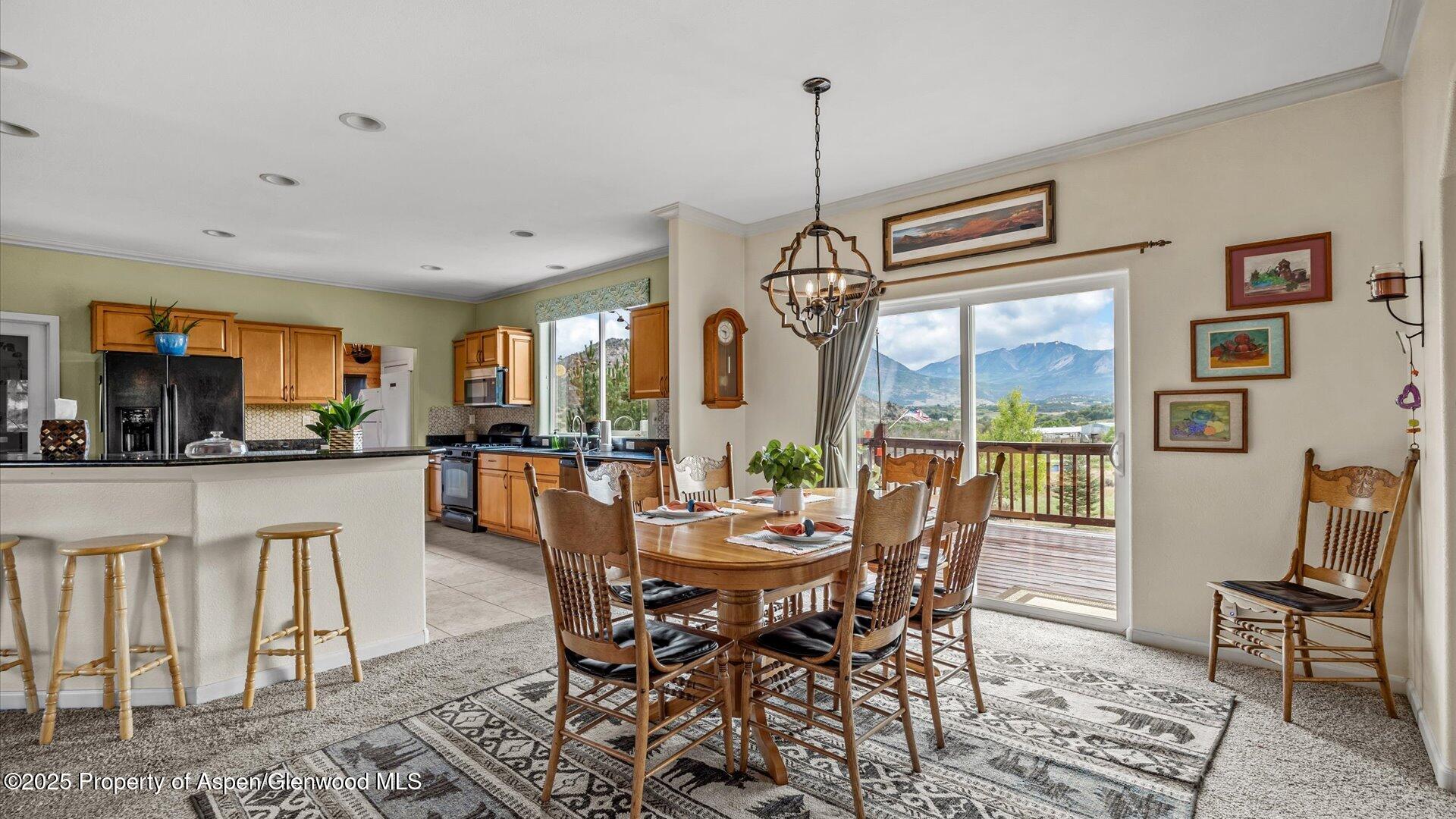 40380 D Road Crawford, CO 81415 - Photo 19 of 52 a view of a dining room with furniture window and outside view