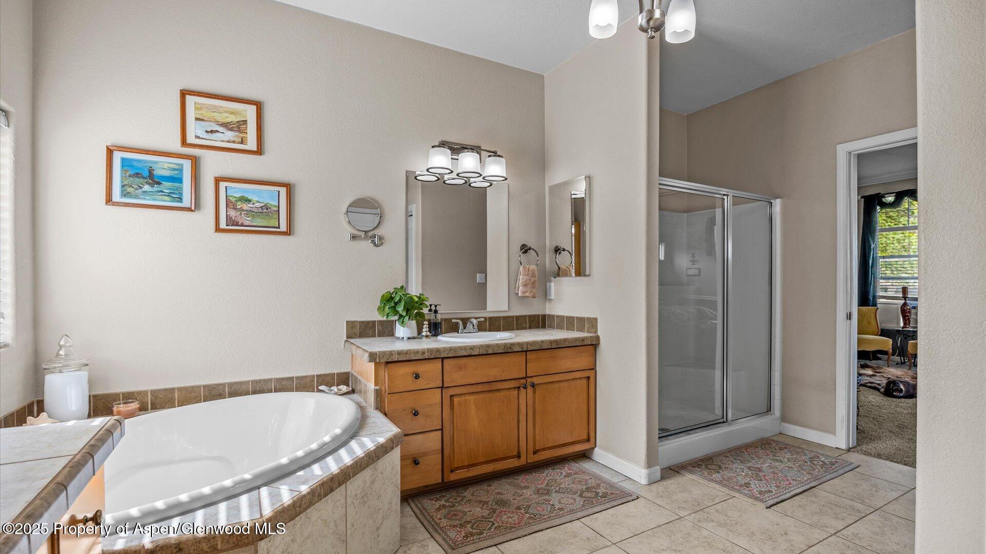 40380 D Road Crawford, CO 81415 - Photo 26 of 52 a bathroom with a tub sink and mirror