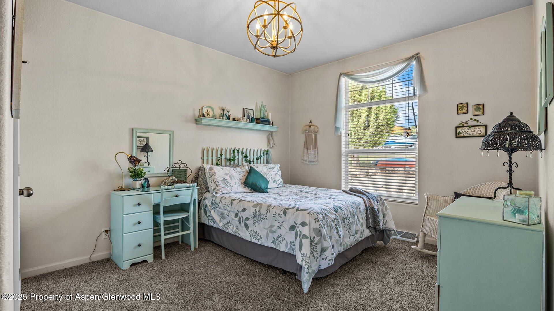 40380 D Road Crawford, CO 81415 - Photo 27 of 52 a bedroom with a bed and a window