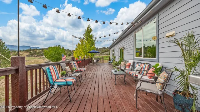 a view of a house with a yard porch and sitting area