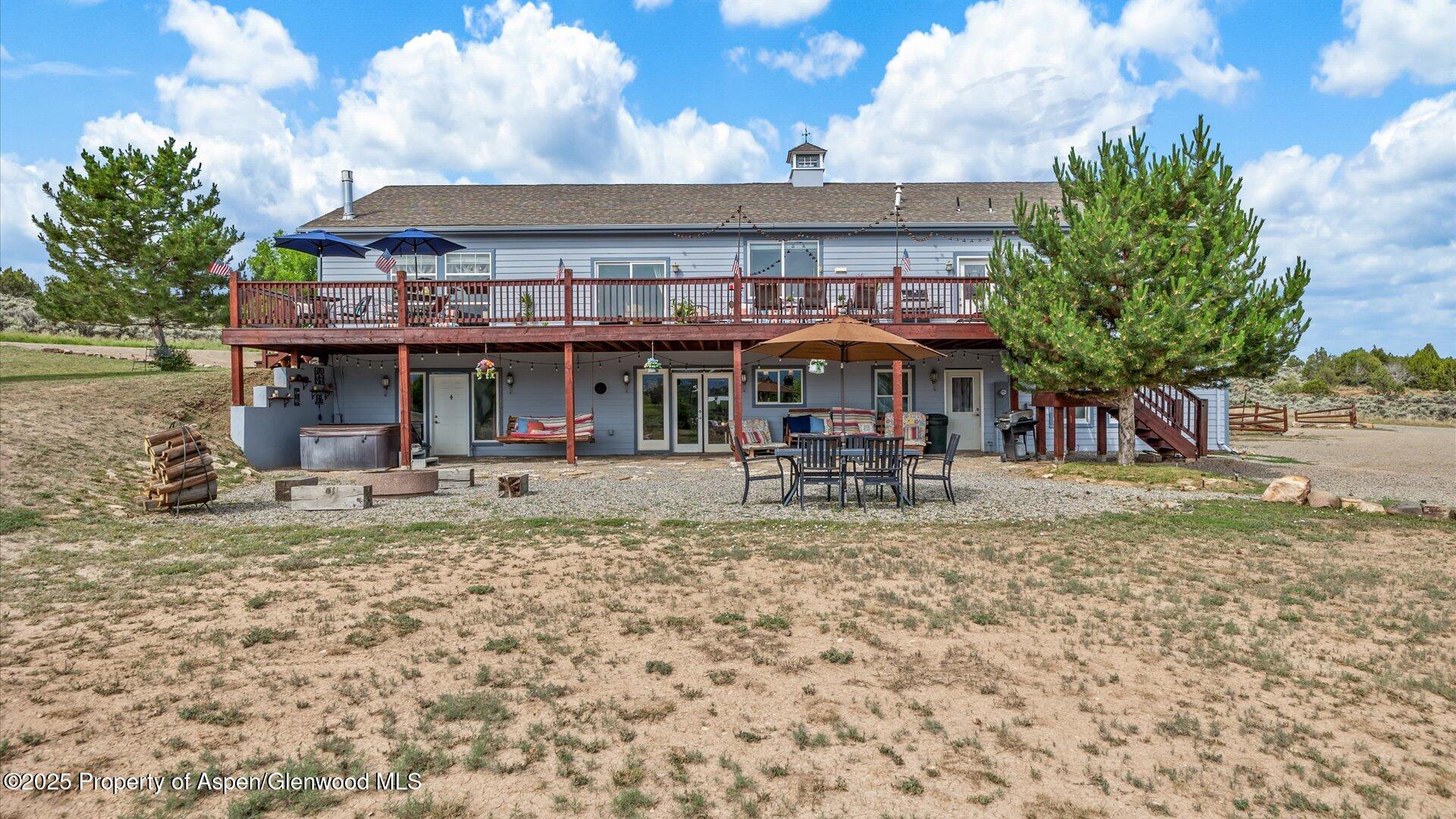 40380 D Road Crawford, CO 81415 - Photo 35 of 52 a view of a house with a yard porch and sitting area