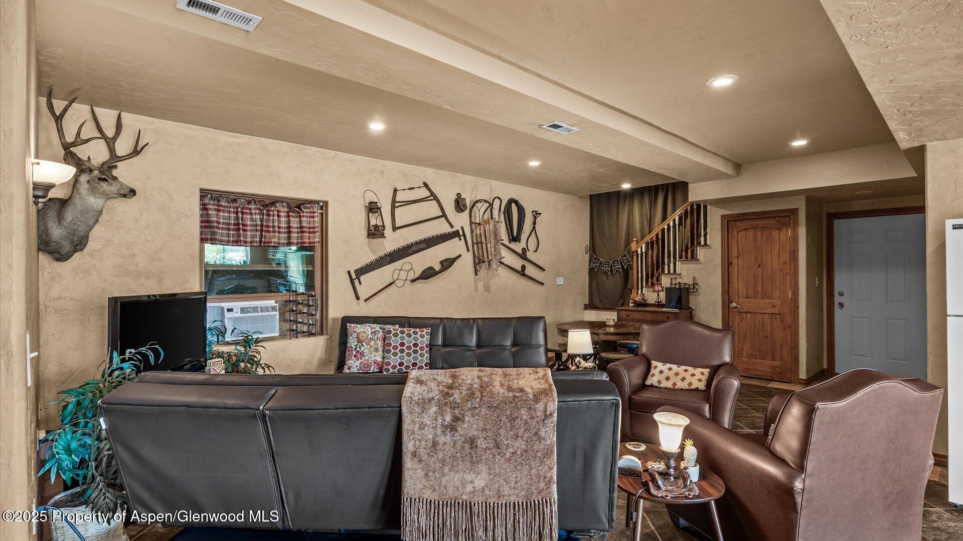 40380 D Road Crawford, CO 81415 - Photo 37 of 52 a living room with furniture and a fireplace