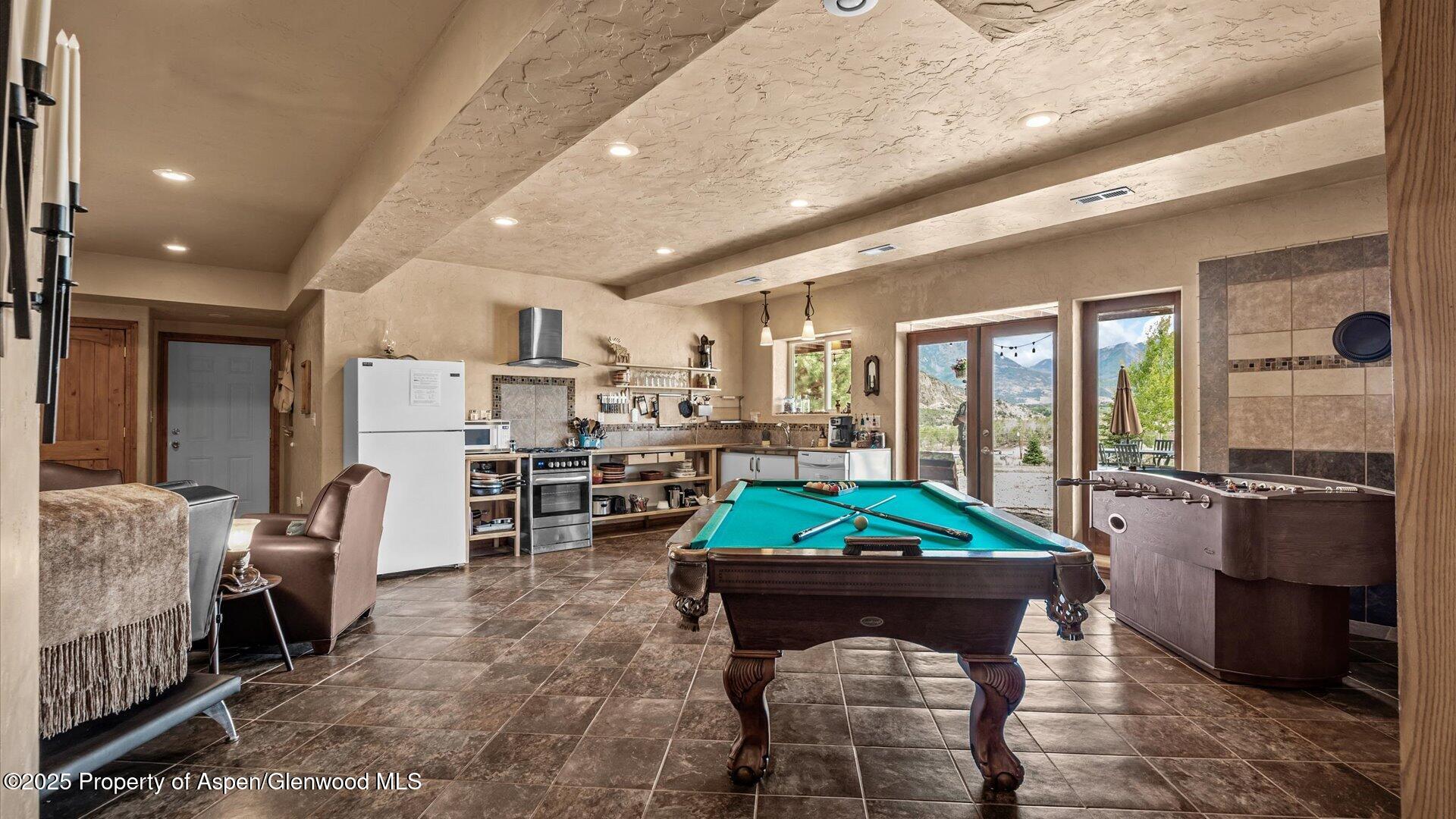 40380 D Road Crawford, CO 81415 - Photo 40 of 52 a living room with furniture and a dining table with kitchen view